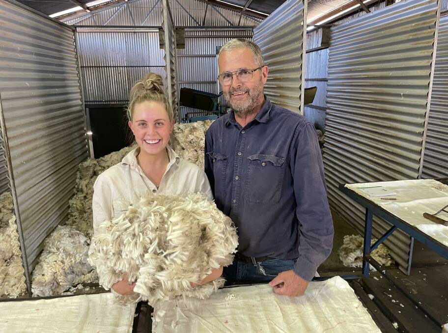 Madeline and Dirk Stevens shearing lambs at Kulaba. 