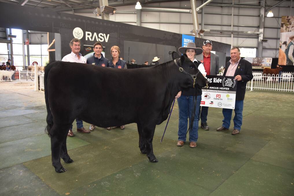 CHARITY HEIFER: Peter, Mostyn and Karen Golding, with handler Tiffany McLauchlan, P.J Cattle Co, Tiffany McLauchlan, Little Meadows Wilcoola P7, the Black Dog Ride's Peter Milton and Jim Conroy.