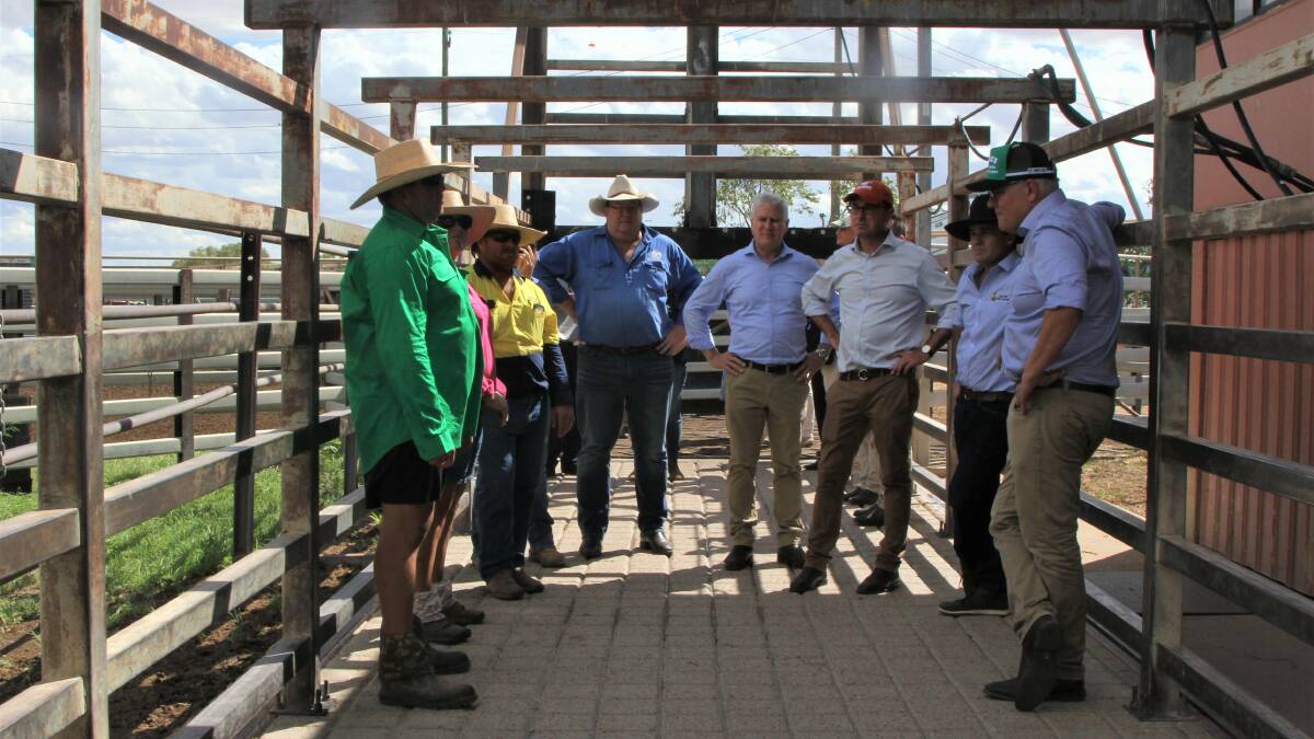 Winton Saleyard managers Gavin and Jodie Smith explain the role of the yards in processing cattle to various sale destinations to Prime Minister Scott Morrison and fellow federal government ministers on Tuesday. In 2020 some 15,000 head went east by train, 112,000 were weighed through the yards, and 60,000 were spelled there.