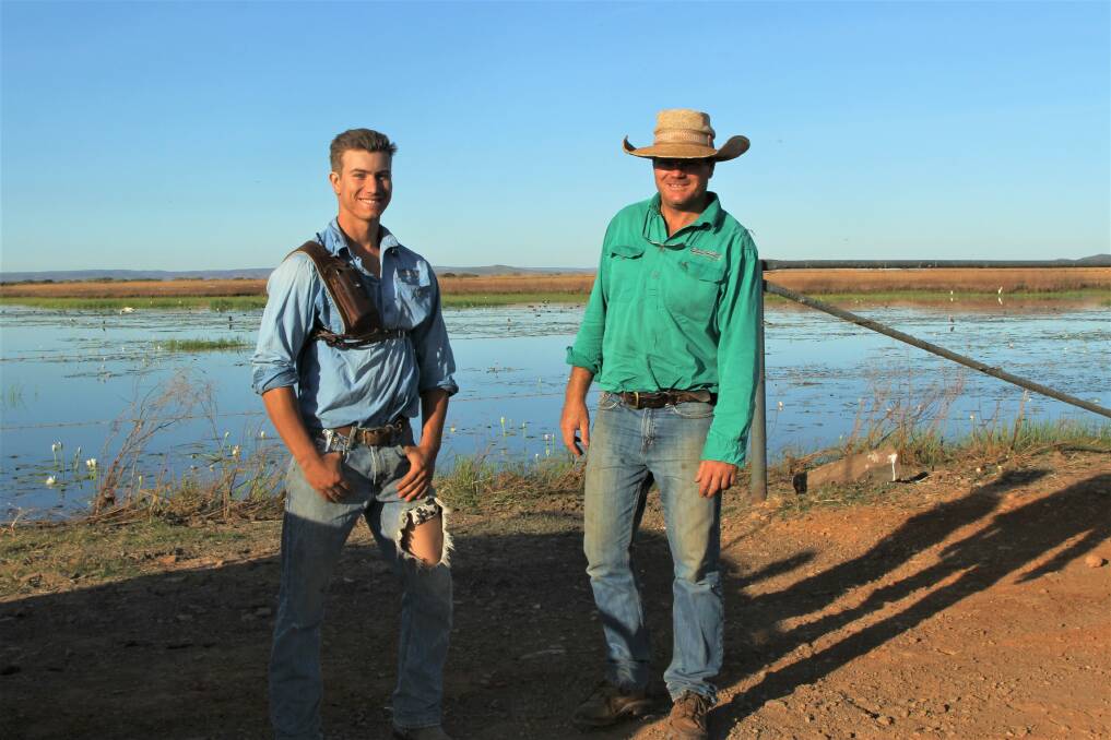 Legune stockman Ben Fenwick, Brisbane and manager Anthony Cox wait at Croc Crossing for the chopper to push cattle out of the scrub and onto the floodplain. Pictures: Sally Gall