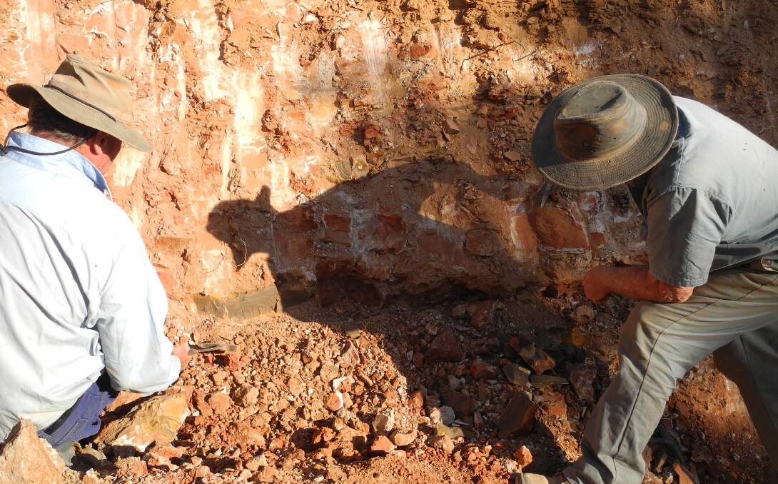 Miners looking at the boulder level in sandstone. Picture: Supplied.