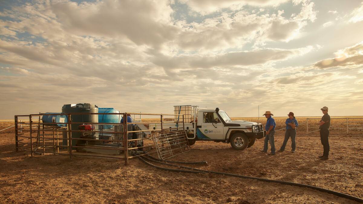 DIT operators at work installing a dosing system in north west Queensland.