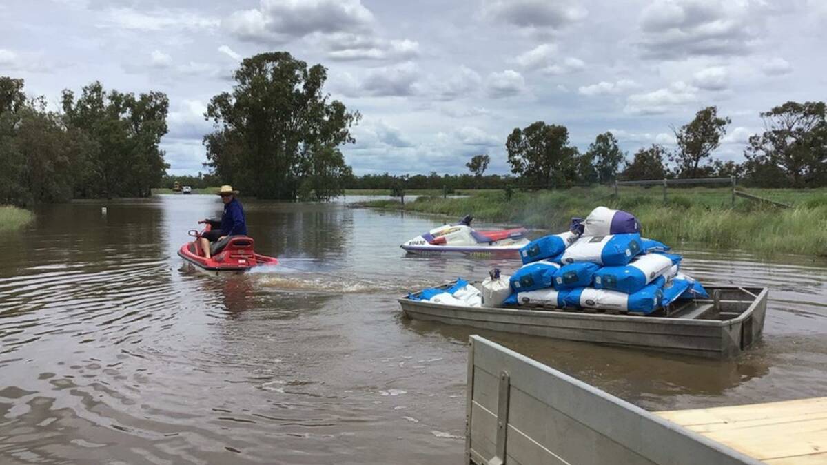 Staff at Undabri, west of Goondiwindi, are using jetskis and boats to get seed across flooded waterways to sowers in a last ditch effort to get a cotton crop in the ground. Pictures supplied