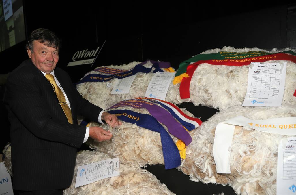 Wal Merriman, Merryville stud, Boorowa, with his three prize-winning fleeces on display at the Ekka. Photo: Sally Gall