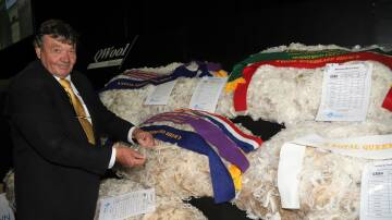 Wal Merriman, Merryville Stud, Boorowa, NSW with his three prize-winning fleeces on display at the Ekka. Pictures: Sally Gall