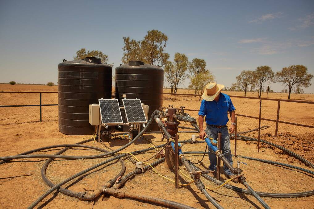 Direct Injection Technologies chief executive officer Mark Peart checking one of the water supplementation systems in north west Queensland. Picture: Supplied