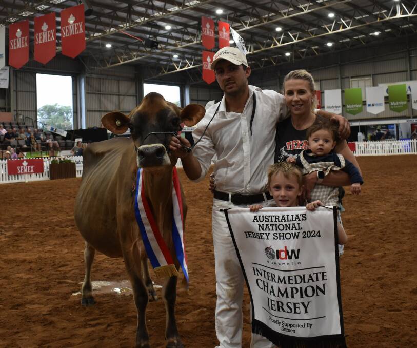 Ben Pedretti and partner Kara Blizzard, Tallygaroopna, Vic, and children Darcy Blizzard and Harris Pedretti, with their intermediate champion cow, Cherrylock Dreaming Of Olives. Picture by Alastair Dowie