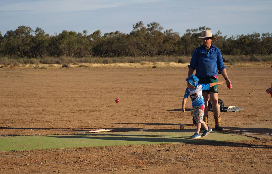 John Crossley bowling while Michael Stalley coaches at Mossgiel. Photos: Michelle Crossley