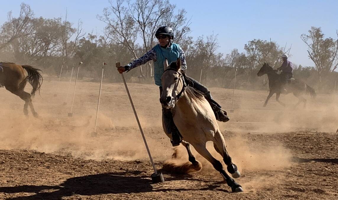 Annie Mannion in a flag race for the 18 years and over age group at Milparinka Gymkhana, an event that has been held in the outback for nearly 70 years. Photo by Zanna Gale.