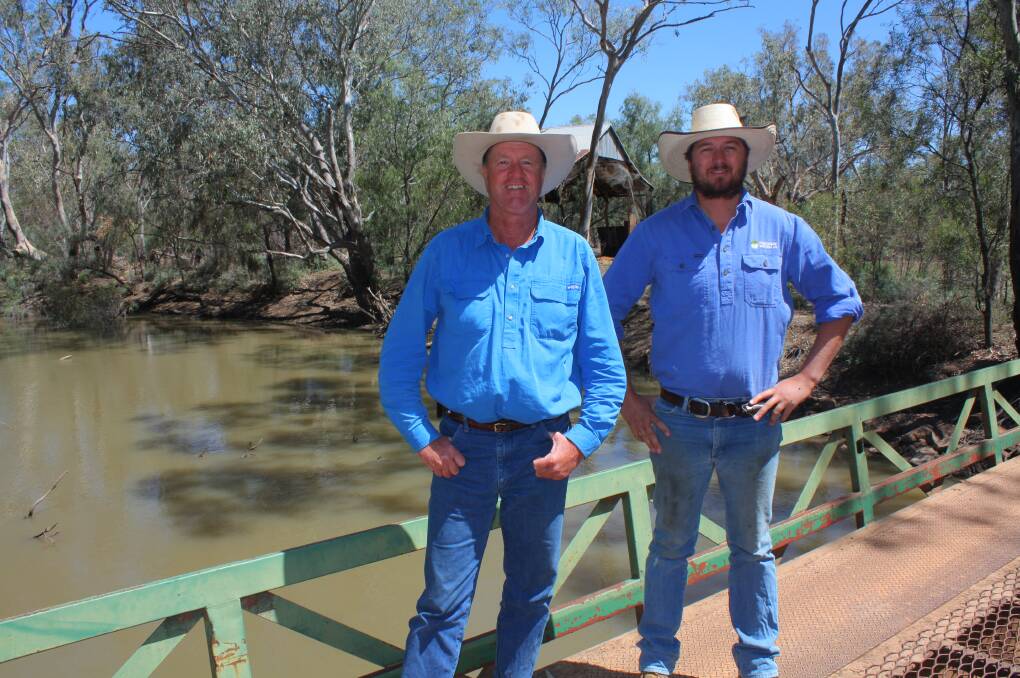 Oxley Station manager Greg Murie and assistant manager Angus Campbell on the station bridge across the Macquarie River. The bridge was built in the mid-1960s, replacing the earlier Leahy bridge.

