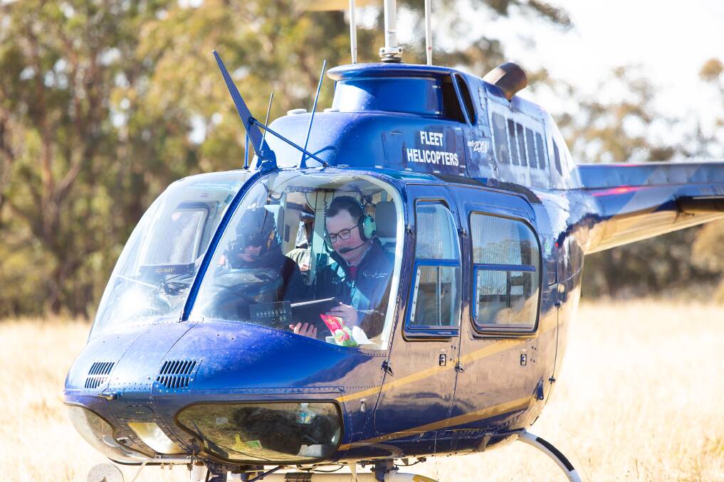 Agriculture Minister Adam Marshall went in a helicopter on the weekend to view the large scale baiting program conducted by the LLS. Photos: Simon Scott