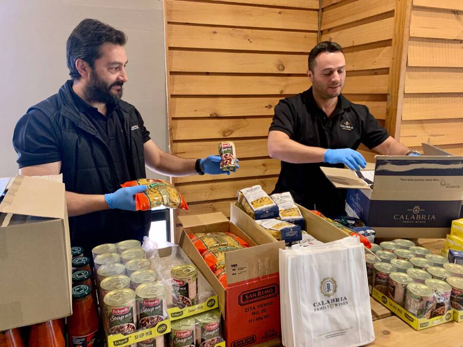 Michael and Andrew Calabria packing the Calabria Family Care Packs. Photo: Calabria Family Wines