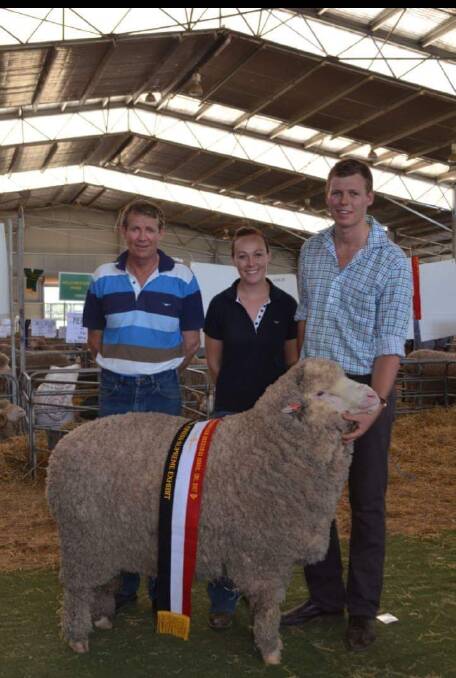 Malcolm, Bec and Cameron Cox with the supreme exhibit ram at the 2017 Armidale Ram Show and Sale. It's this fleece that is being donated.