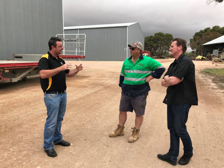 Grain Brokers Australia principal Jeff Winspear, David Hanrahan general manager eastern Australia (right) discussing grain marketing with Mark Schilling. Photo supplied.