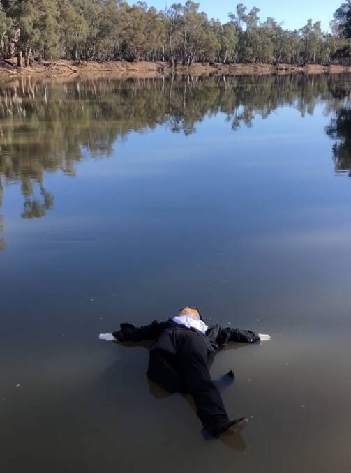 The effigy of Water Minister David Littleproud floating down the Murray.