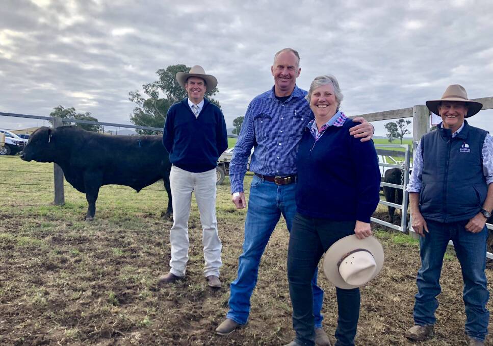 Auctioneer Paul Dooley, Don and Alison Cameron with Ted Laurie and the top priced bull Knowla Packer P130 that sold for $30,000. Photo: Samantha Townsend