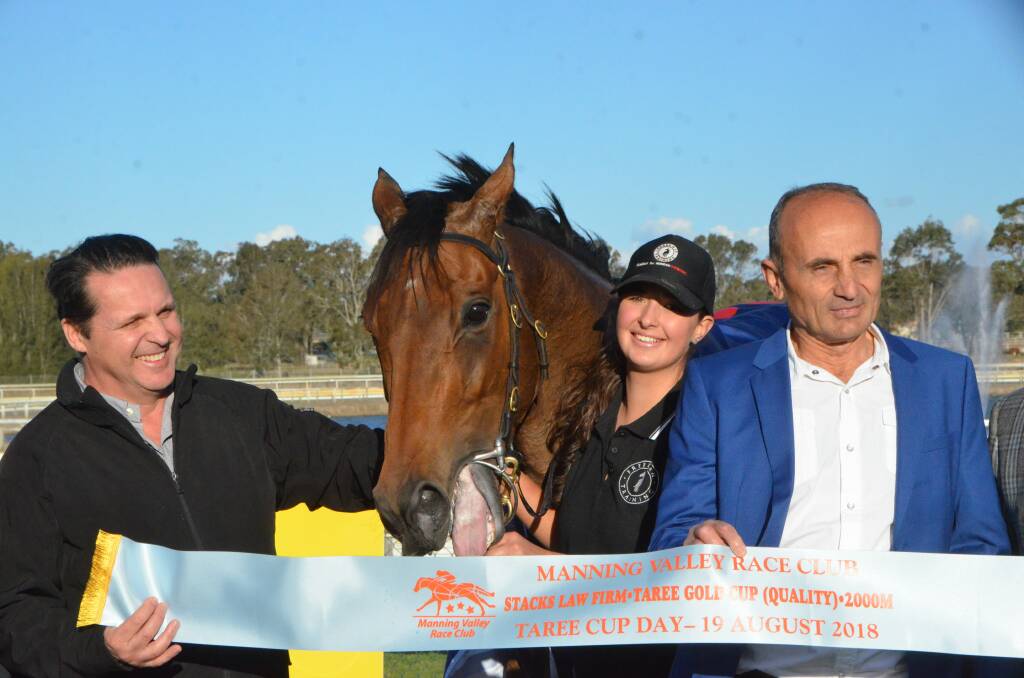 Rosehill trainer Richard Freedman with his Taree Cup winner Shalmaneser, strapper Eliza Babazogali and the gelding’s Sydney owner David Zomaya at their victory.   