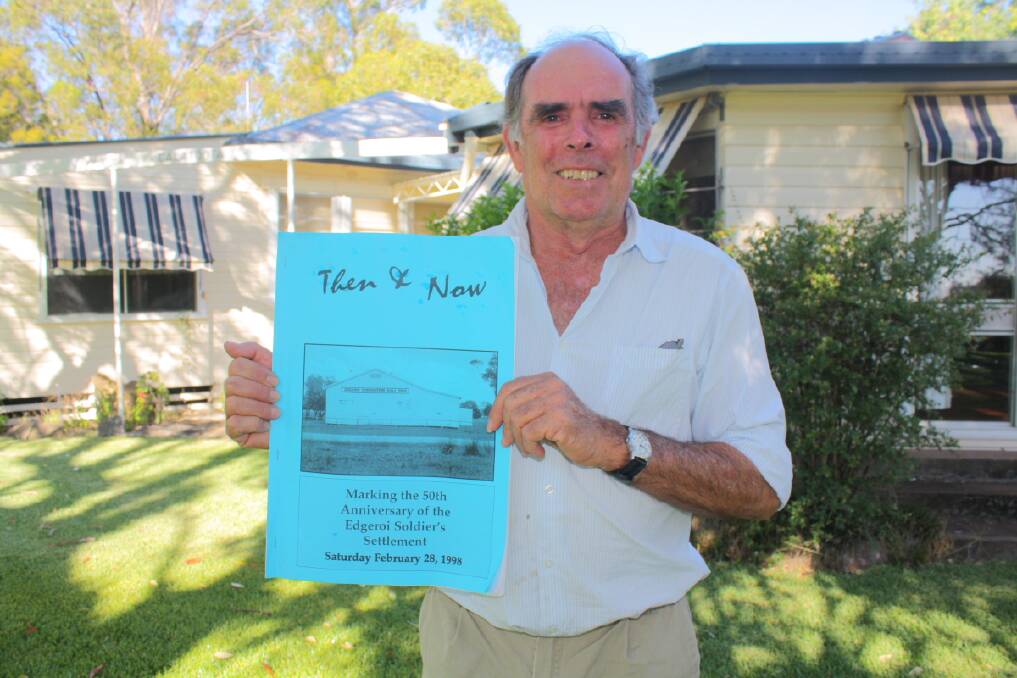 Andrew Campbell, “Calatoota”, holds a copy of the booklet produced by his soldier-settler father, Peter, in 1998 to commemorate the 50th anniversary of Edgeroi settlement.