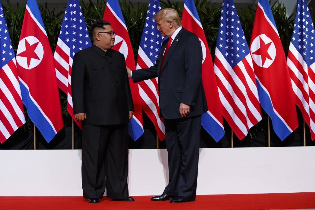 President Donald Trump meets with North Korean leader Kim Jong Un on Sentosa Island on Tuesday in Singapore. (AP Photo/Evan Vucci).