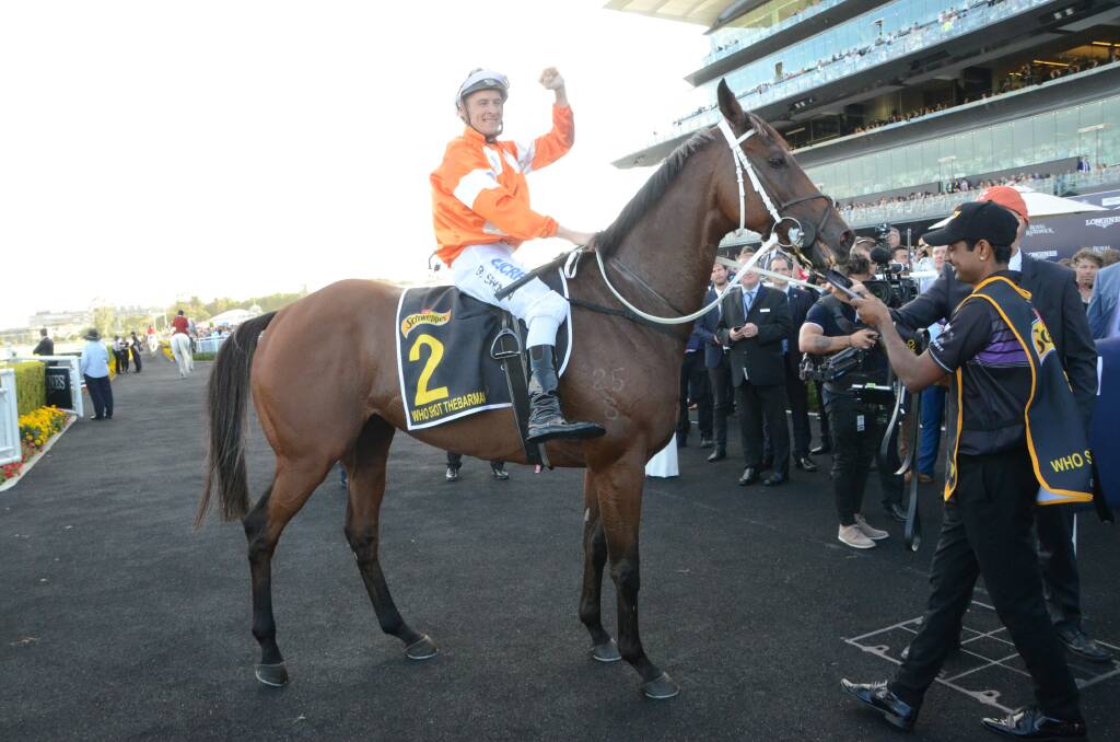 Winning jockey Blake Shinn aboard Who Shot Thebarman salutes the huge cheering crowd at Randwick after the pair won this year’s Sydney Cup in April. Photo by Virginia Harvey.