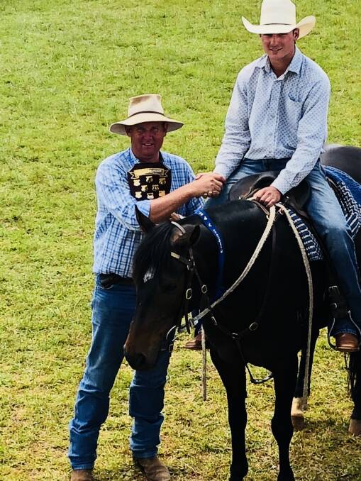 John Corrigan presenting the Con and Dulcie Debreceny Memorial Shield to the maiden campdraft winner Bevan Wood from Walcha, riding Sunray with a score of 91.