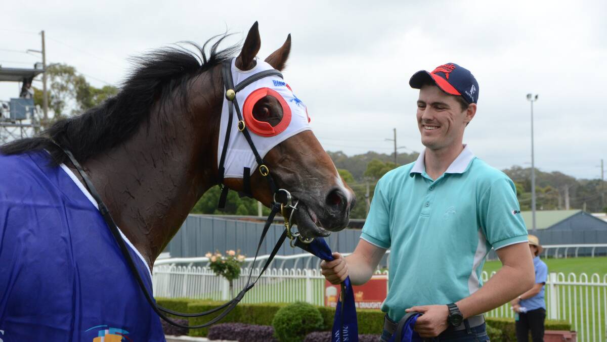 Strapper, Jock Rice-Ward with Unite And Conquer was all smiles after the colt’s impressive win in the Wyong Magic Millions juvenile race last week.    Photo Virginia Harvey 
