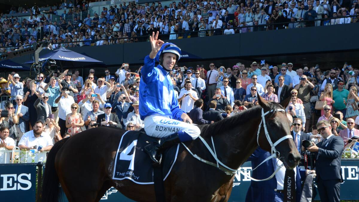 The crowd stands and applauds Winx and jockey Hugh Bowman after her George Ryder Stakes-G1 win.    