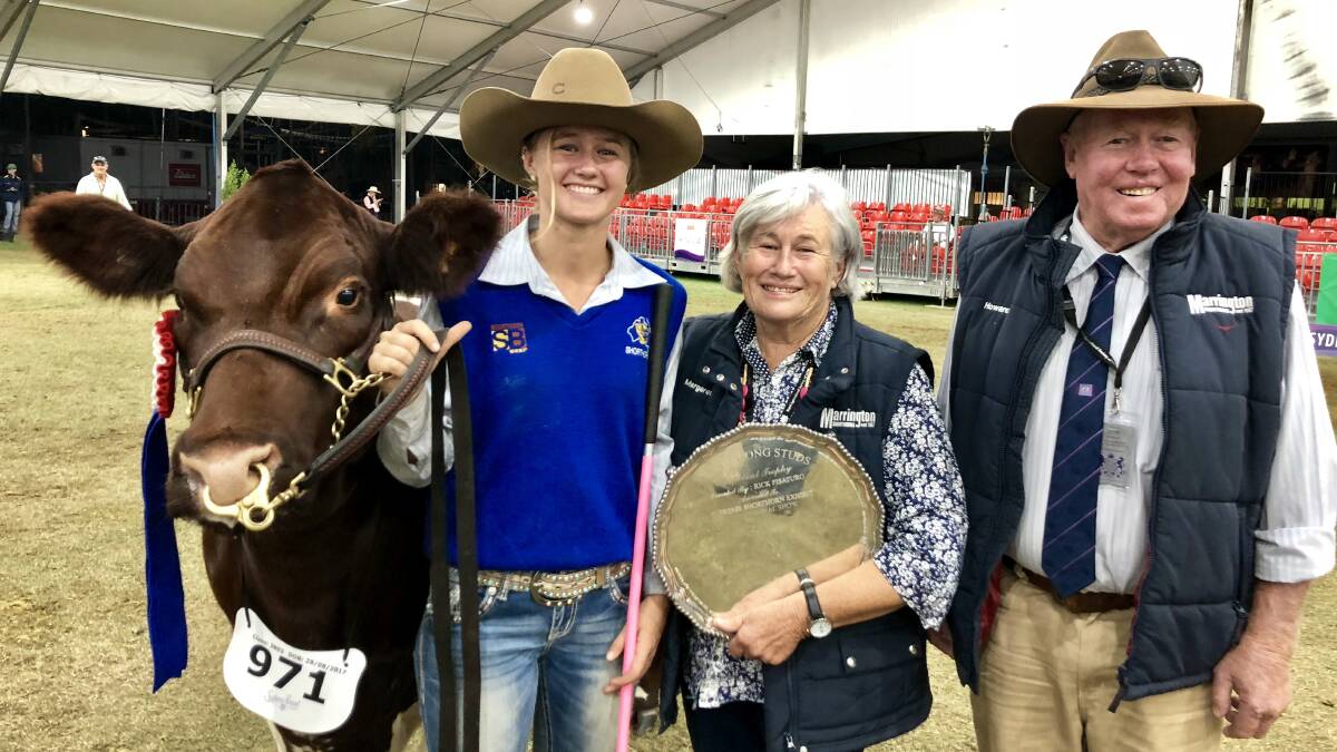 Howard and Margaret Williams with their granddaughter Clare Amor after winning best exhibit in the Shorthorns ring at Sydney Royal. Photo by Samantha Townsend.