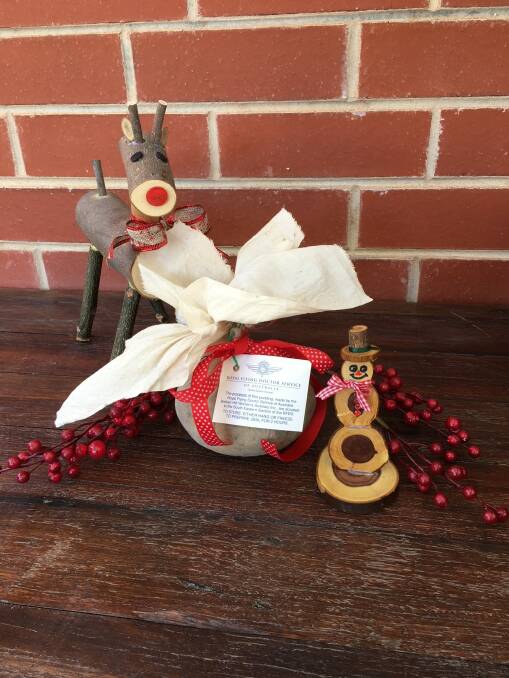 The pudding with Christmas decorations that are made by Sarah and Mike Siemer that are available at Sitting Bull, Broken Hill.