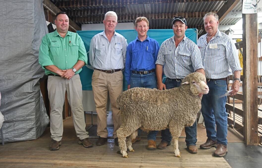 Nutrien stock agent Brad Wilson, AWN stock agent John Croake, buyer Justin Hoad, North Mihi, Uralla and vendors Edward and Rob Blomfield with one of two top price rams. Photo: Billy Jupp 