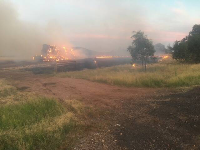 UP IN FLAMES: Around 100 hay bales burned after a hay stack caught fire on a Grain Valley Road property in Boggabri on Wednesday evening. Photo: Supplied