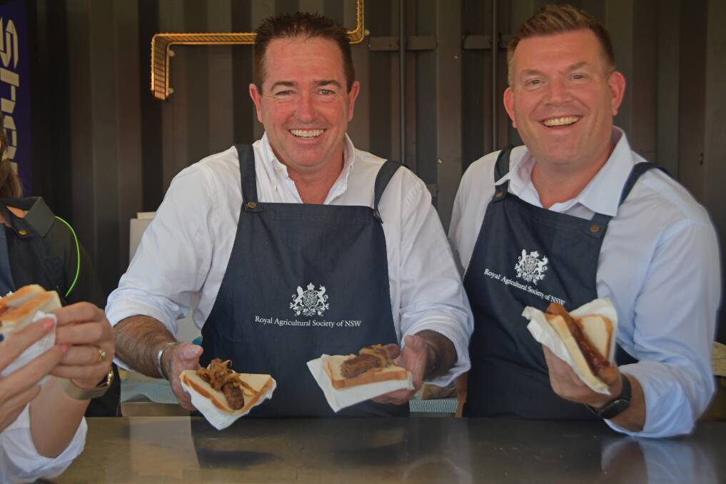 Deputy Premier Paul Toole and Agriculture Minister Dugald Saunders were serving up sausages on Thank a Farmer Day at the Sydney Royal.