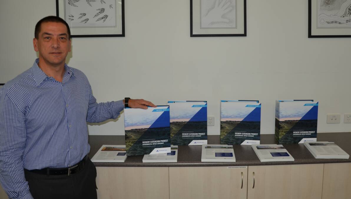 MOVING FORWARD: Whitehaven Coal CEO Paul Flynn shows off the five volumes of the company's Vickery Extension Project EIS. Photo: Billy Jupp 