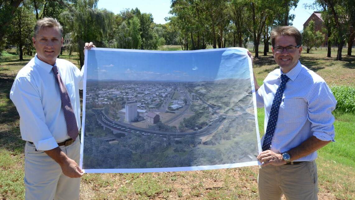 IN MOTION: Gunnedah mayor Jamie Chaffey and Tamworth MP Kevin Anderson announce a contractor has been chosen for the new Gunnedah rail overpass project. Photo: Photo: Billy Jupp 