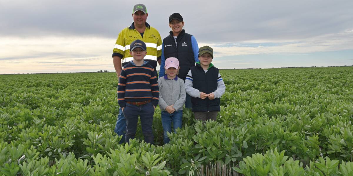 ATD Farming's Tom, Melissa, Max ,Georgie and Jack Greentree in one of the family's faba bean crops near Mungindi. Photo: Billy Jupp 