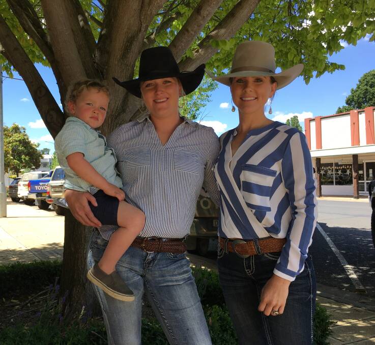 Walcha Jackpot Campdraft committee members Rach Flanagan (holding son Harry McMaugh) and Em Pendergast are pulling out all the stops for this weekend's event. Photo: Billy Jupp 