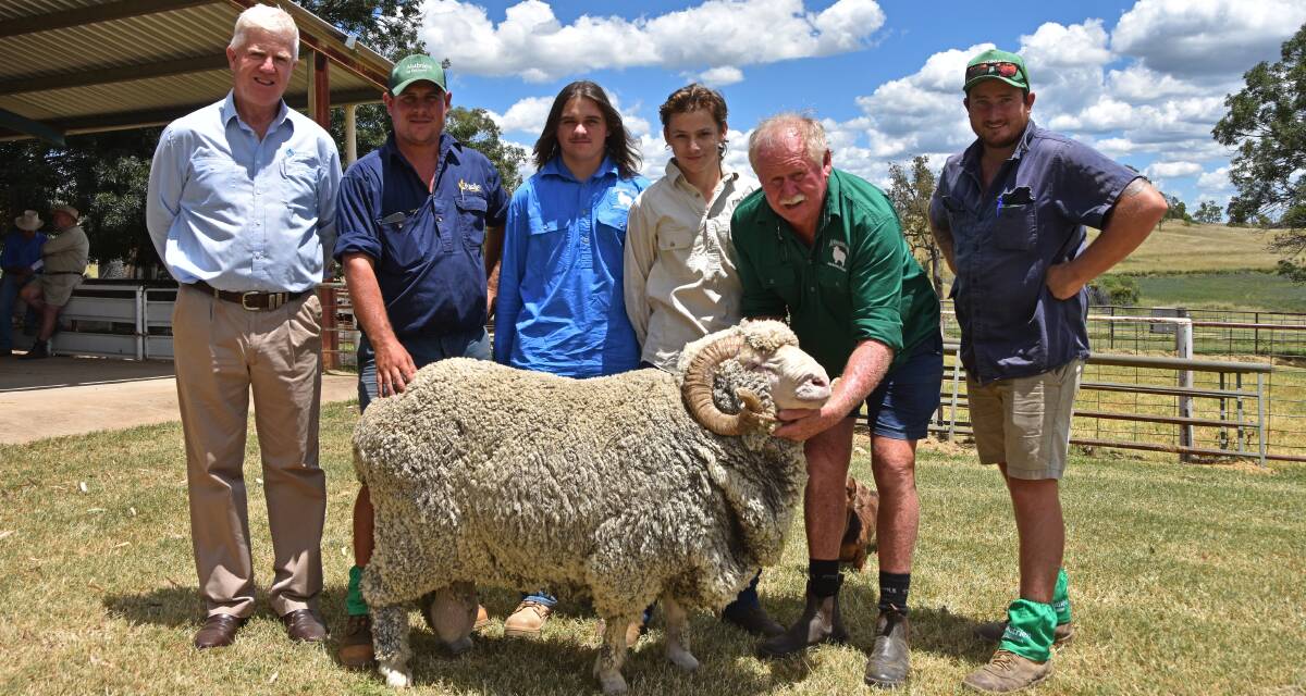 AWN's John Croake, buyer, Ford End Pastoral Company's Phil Taylor, Kurrajong Park's Elijah Lane, Lachlan Lane and Rodney Kent, and Ford End Pastoral Company's Luke Taylor with the top ram. Photo: Billy Jupp 
