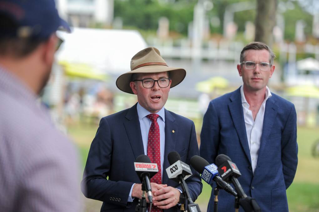NSW Agriculture Minister Adam Marshall (front) is hopeful the announcement made by NSW Premier Dominic Perrottet (back) will help combat the state's labour shortage. Photo: Lucy Kinbacher 