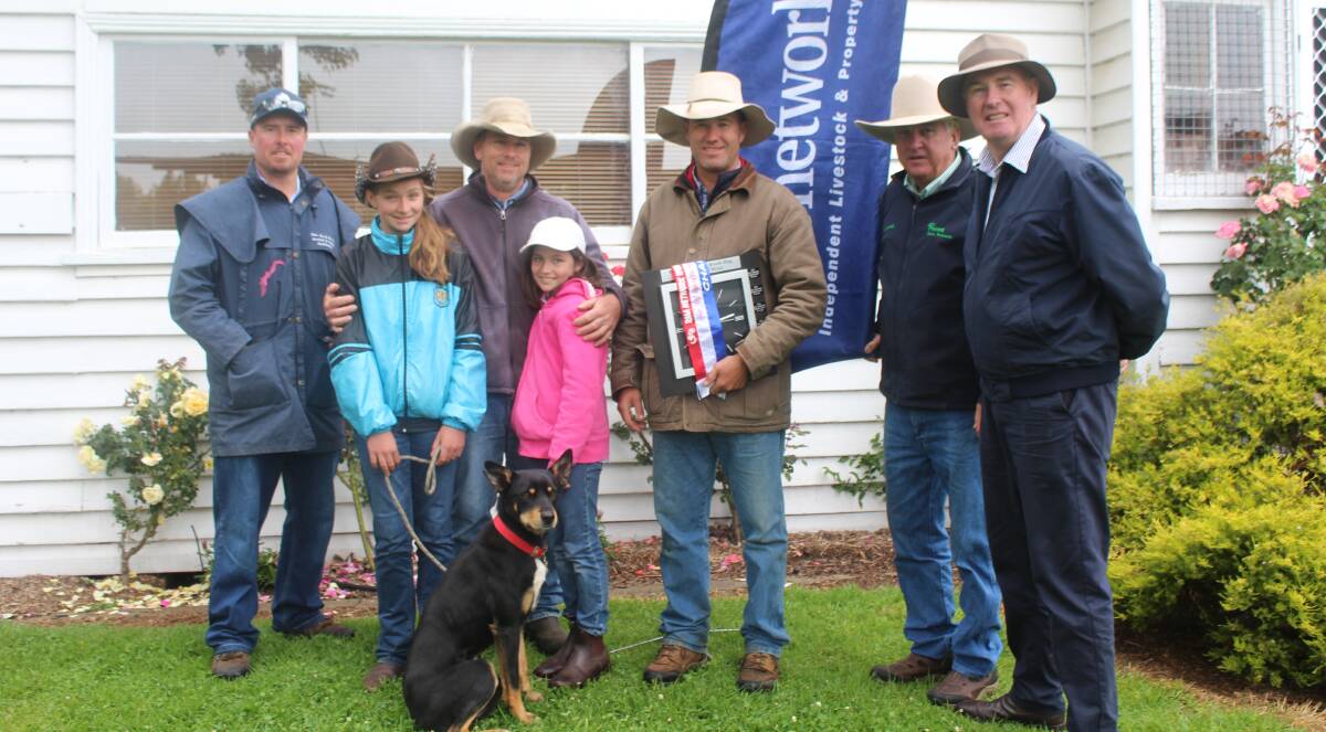 QUALITY DOGS: Shad Bailey, buyer Bruce McLay with his daughters and Gwydir Banjo, vendor Tony Overton, and Phillip Frame and John Peden from rma network.