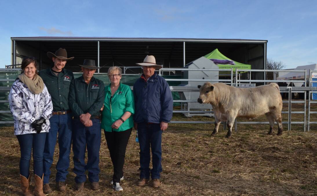 Kayla, Laiton, Eric and Helen Turnham, Waratah Speckle Parks, Guyra, with buyer Robert Doak, Drogheda Speckle Parks, Bundarra and the $14,000 top-priced bull.