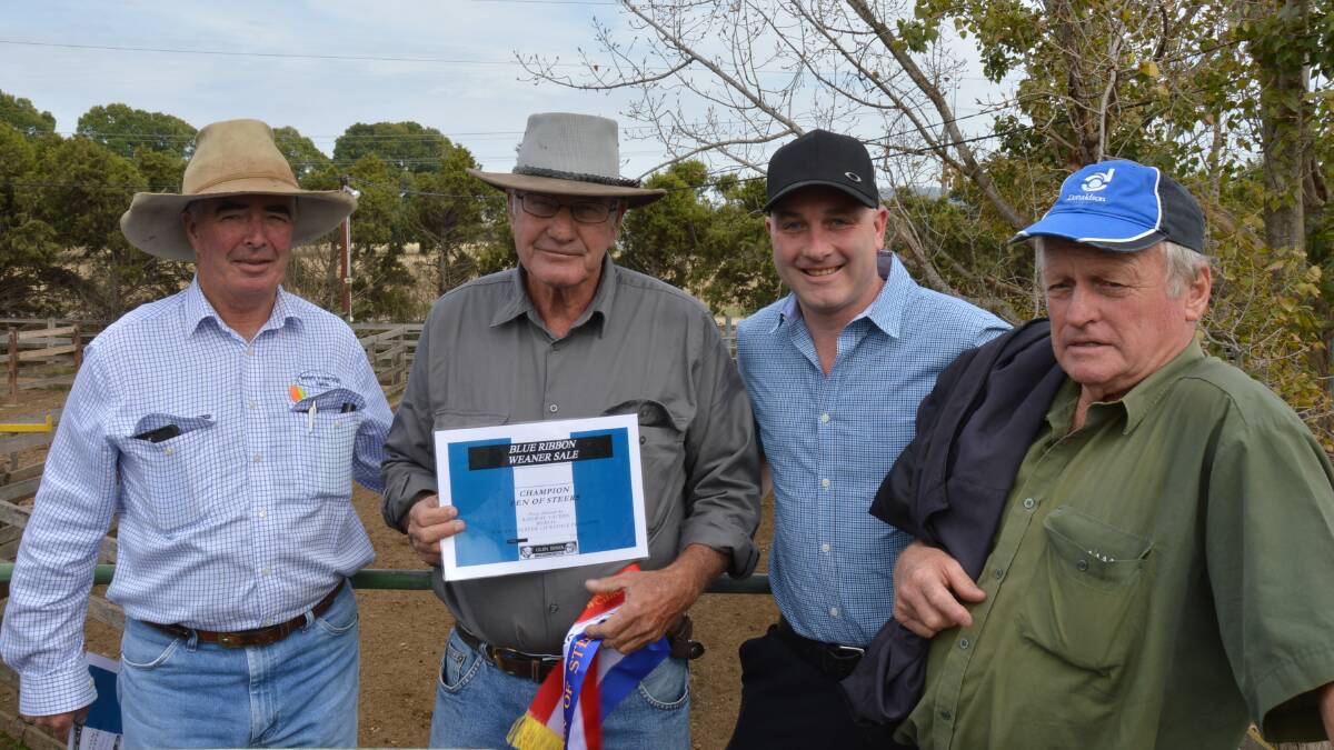 Glen Innes Agents Association president Barry Newberry and Robert Pietsch, Yarraford Station, Glen Innes, who had the champion pen of steers, with sponsors Nathan Sanderson, Railway Tavern, and Malcolm Lockyer, Lockyer's Transport.