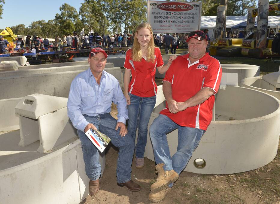 Justin Martin, Gemma Martin and Peter Graham check out some of the concrete products that will be on display at AgQuip this year.