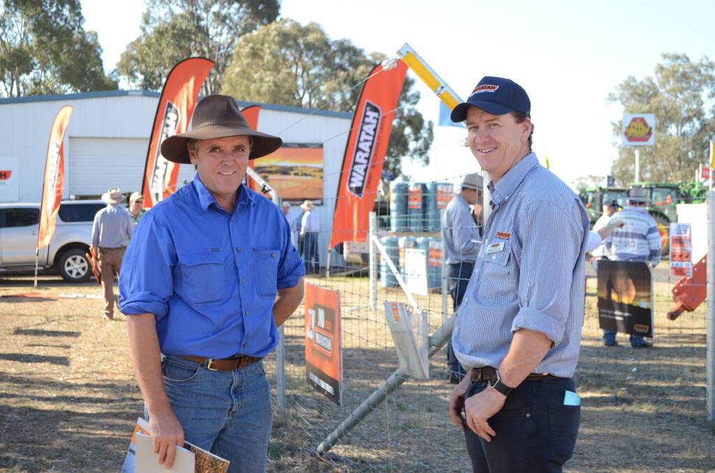 Bruce Kirsop, "Cedars", Gilgandra, looking at an example of exclusion fencing at AgQuip with Waratah Fencing territory sales manager James Kennedy.