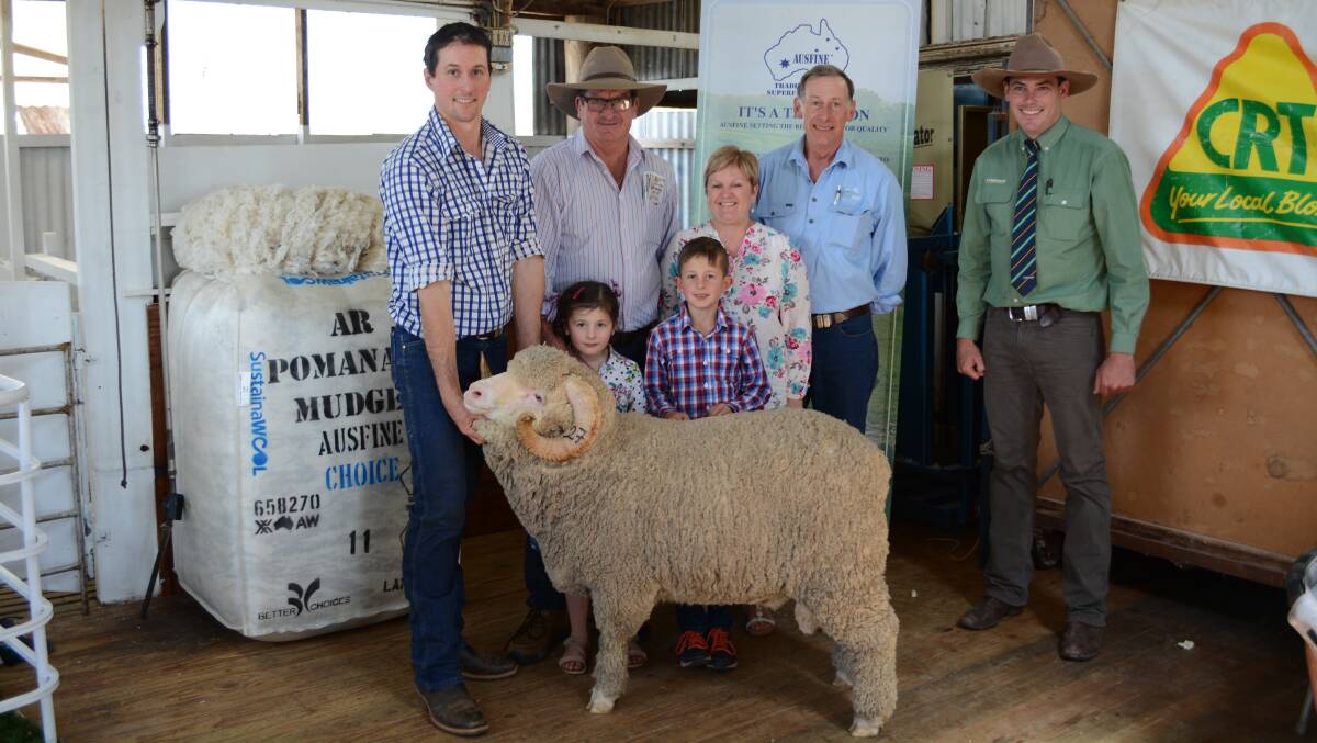 James Rayner holds sale-topper, buyers Garry, Linda, Lacey and Aiden O'Reilly, Marcus Schembri, Landmark.