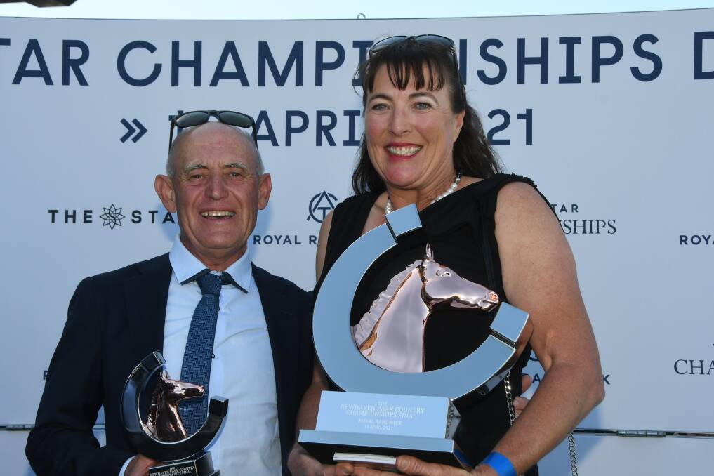 Trainer Terry Robinson and wife Monique with Country Championship Final trophies after Art Cadeau won the Newhaven Park sponsored event at Randwick last Saturday. Photos by Virginia Harvey