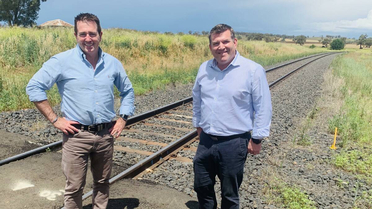 Minister for Regional Transport and Roads Paul Toole and Member for the Dubbo Dugald Saunders at the Maryvale rail line near Wellington.