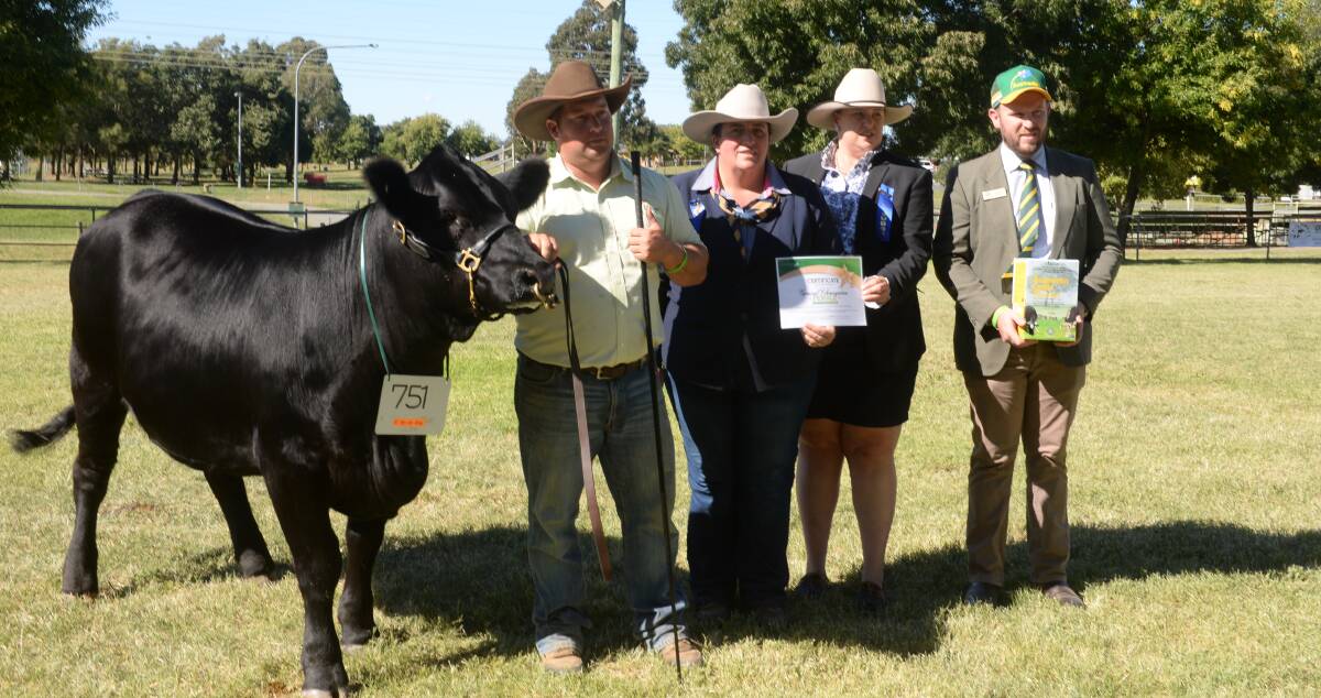Junior and grand champion female and supreme Simmental exhibit, with Hayden Green, judge Rene Keith, associate Emily Polsen and sponsor Shannon Lawlor.