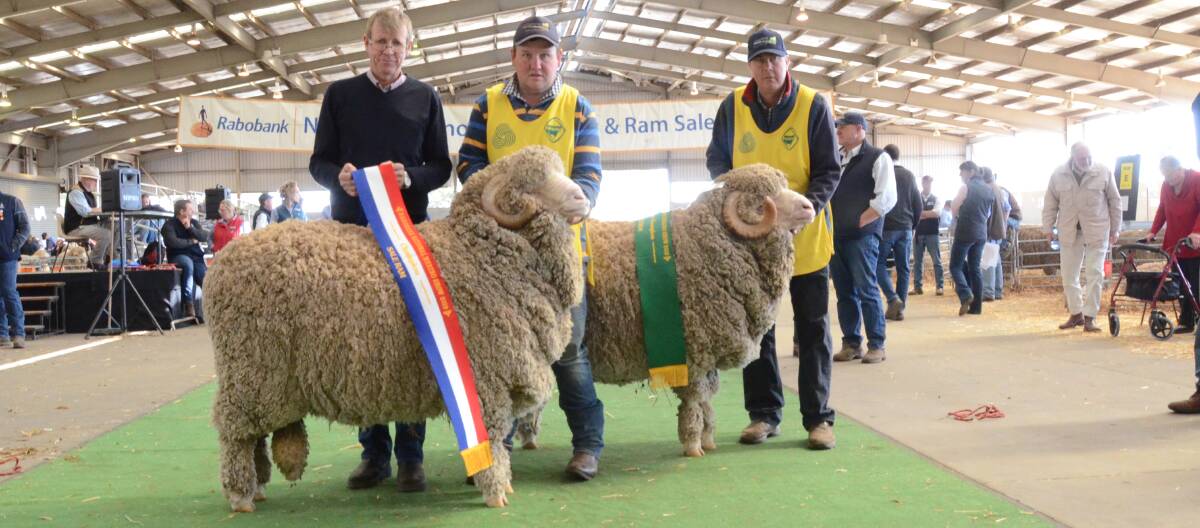 Langdene double: Chief steward Malcolm Cox, Mudgee, sashes grand and reserve sale ram champions, held by Ben Simmons and Garry Cox, Langdene stud, Dunedoo.