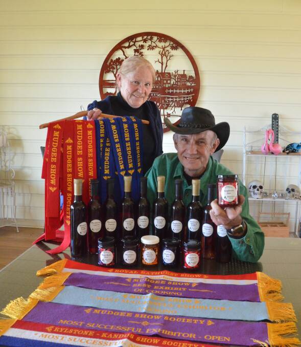 Kate and Garry Richards show off their show ribbons and their tasty raspberry and other berry jams, wines, liqueurs and vodkas.