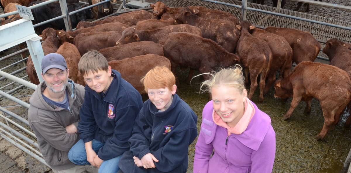 Dominic and Henry Den, “Wilburtree”, Dubbo; Will Gahan of Ryde and Magdalena Meyer, Braunschweig, Germany, and their $750 a head Droughtmaster steers.